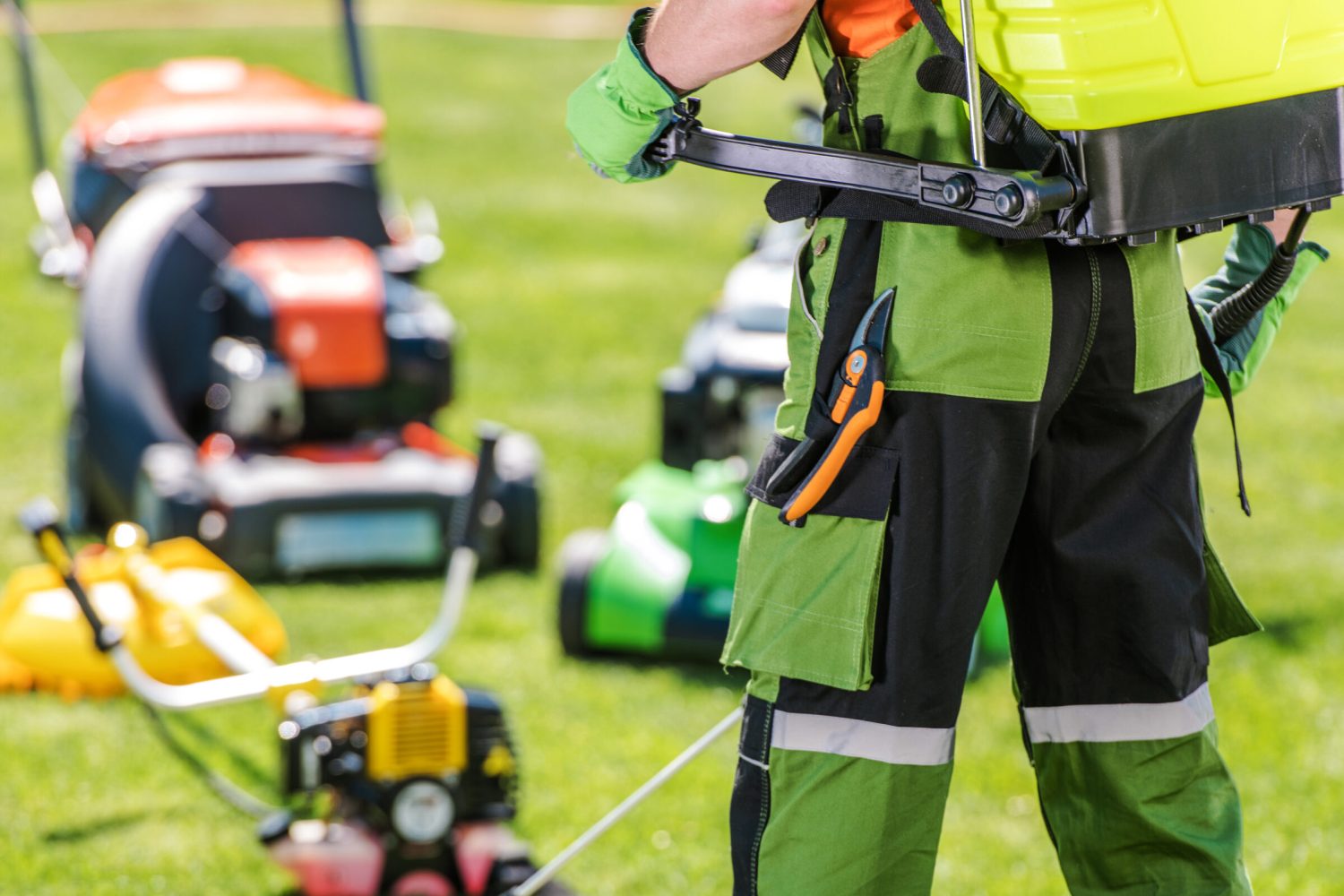 Gardening and Landscaping Industry Theme. Professional Caucasian Gardener and His Garden Equipment.